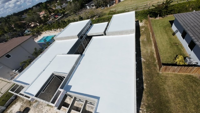 Aerial view of completed custom home roofing
